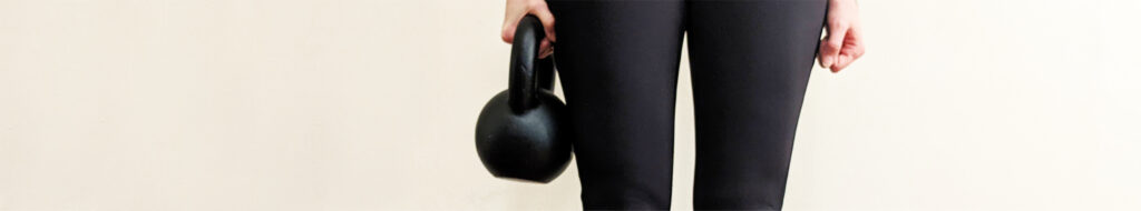 person holding a kettlebell