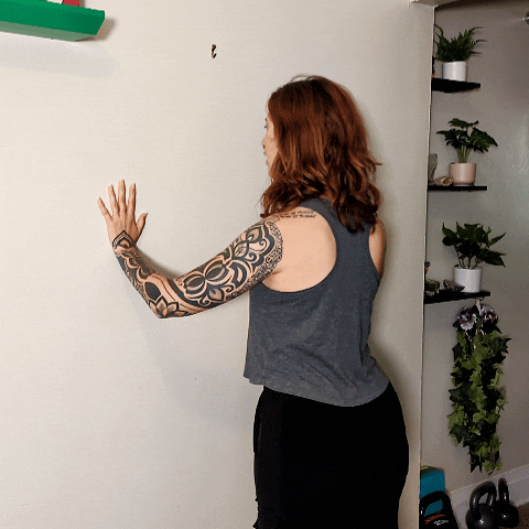 wall push up, one of four easy simple exercises to do at home